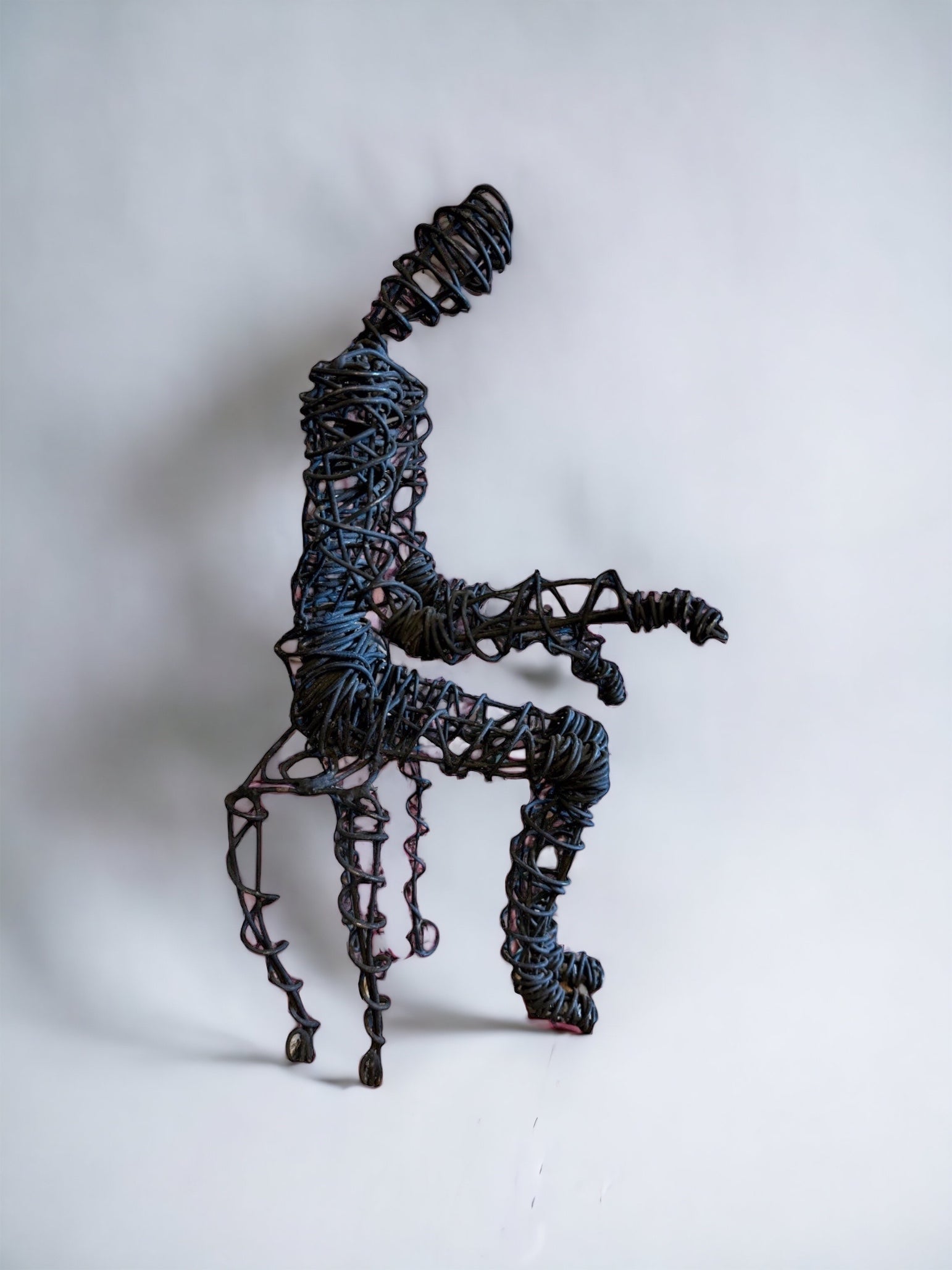 Brutalist Wire Man Sitting Man