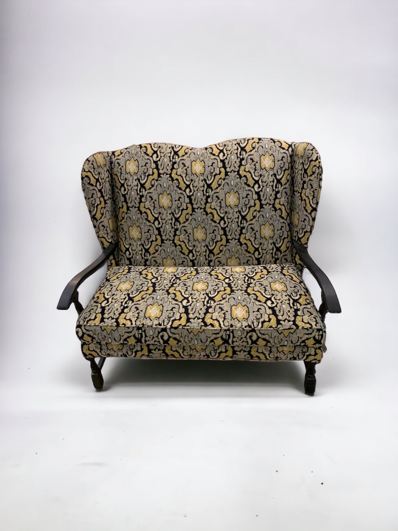 Early 20th Century Wingback Ikat Settee